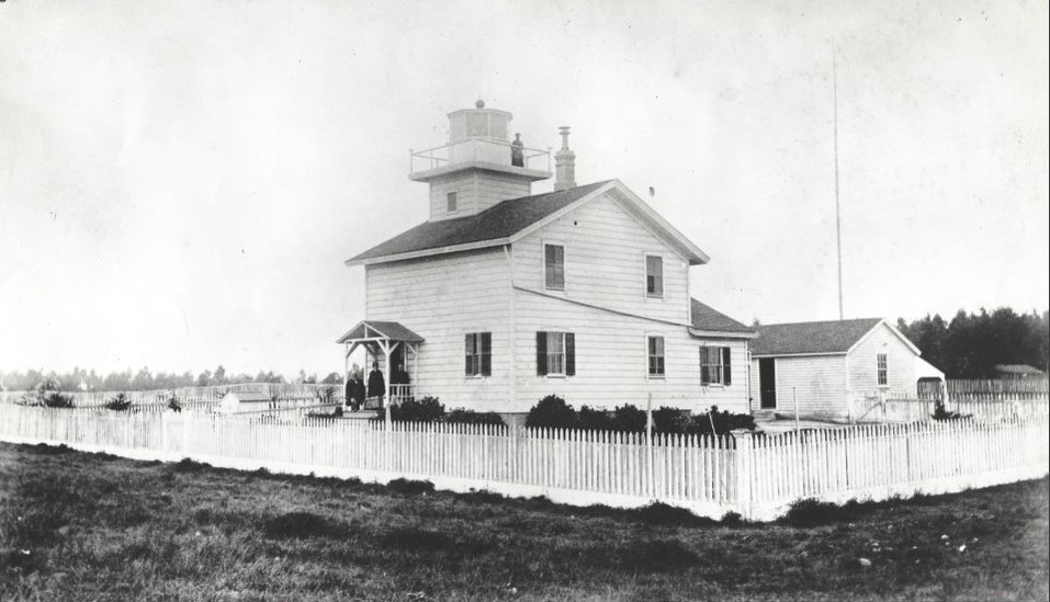 Black and white photograph of the Hecox family standing in front of the Santa Cruz Lighthouse.