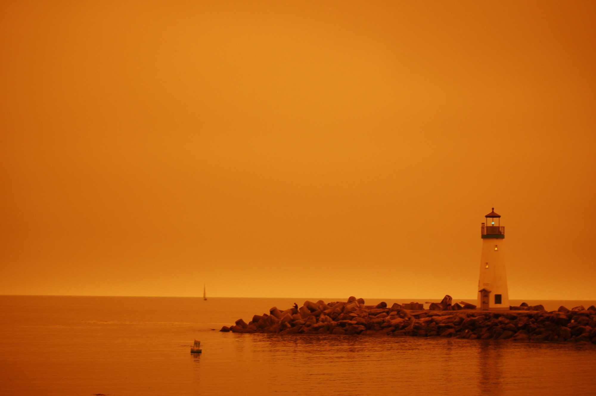 The Walton Lighthouse under an orange glow.