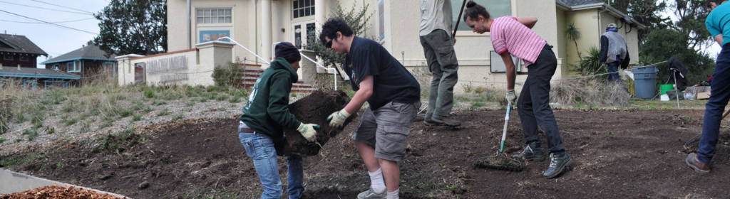 Students performing landscaping outside the museum